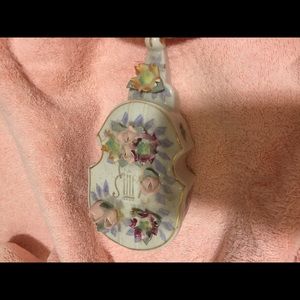 This a classy, porcelain ashtray carrier.